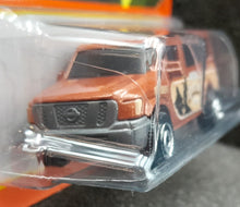 Load image into Gallery viewer, Matchbox 2022 Nissan NV Van Brown #1 MBX Showroom New Long Card