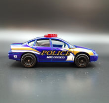 Load image into Gallery viewer, Matchbox 2010 2000 Chevrolet Impala Dark Blue #57 Emergency Response 7/8
