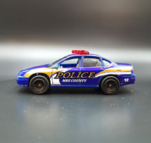Load image into Gallery viewer, Matchbox 2010 2000 Chevrolet Impala Dark Blue #57 Emergency Response 7/8