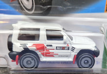 Load image into Gallery viewer, Hot Wheels 2023 Mitsubishi Pajero Evolution White #175 Mud Studs 3/5 New Long Card