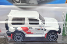 Load image into Gallery viewer, Hot Wheels 2023 Mitsubishi Pajero Evolution White #175 Mud Studs 3/5 New Long Card