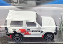 Load image into Gallery viewer, Hot Wheels 2023 Mitsubishi Pajero Evolution White #175 Mud Studs 3/5 New Long Card