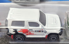 Load image into Gallery viewer, Hot Wheels 2023 Mitsubishi Pajero Evolution White #175 Mud Studs 3/5 New Long Card