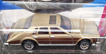 Load image into Gallery viewer, Hot Wheels 2023 '82 Cadillac Seville Gold #75 HW: The '80s 7/10 New
