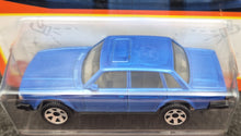Load image into Gallery viewer, Matchbox 2023 1986 Volvo 240 Light Blue #99 MBX Showroom New Long Card