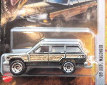 Load image into Gallery viewer, Matchbox 2022 '89 Jeep Wagoneer Black Jurassic World Dominion New Long Card