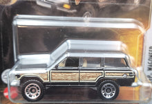 Load image into Gallery viewer, Matchbox 2022 '89 Jeep Wagoneer Black Jurassic World Dominion New Long Card