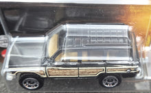 Load image into Gallery viewer, Matchbox 2022 '89 Jeep Wagoneer Black Jurassic World Dominion New Long Card