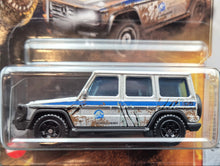 Load image into Gallery viewer, Matchbox 2022 '14 Mercedes-Benz G 550 Silver Jurassic World Dominion New Long Card