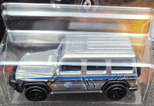 Load image into Gallery viewer, Matchbox 2022 '14 Mercedes-Benz G 550 Silver Jurassic World Dominion New Long Card