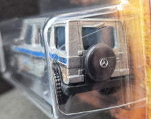 Load image into Gallery viewer, Matchbox 2022 '14 Mercedes-Benz G 550 Silver Jurassic World Dominion New Long Card