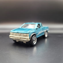 Load image into Gallery viewer, Matchbox 2021 '95 Nissan Hardybody (D21) Teal MBX Off-Road #38/100