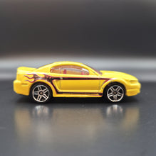 Load image into Gallery viewer, Hot Wheels 2011 '99 Mustang Yellow Team Hot Wheels Commemorative Loose