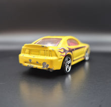 Load image into Gallery viewer, Hot Wheels 2011 '99 Mustang Yellow Team Hot Wheels Commemorative Loose