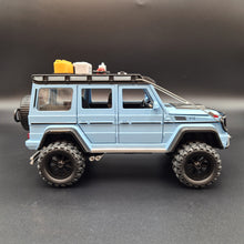 Load image into Gallery viewer, Explorafind 2019 Mercedes-Benz G550 4x4 Squared Sky Blue 1:24 Die Cast SUV