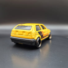 Load image into Gallery viewer, Hot Wheels 2018 Volkswagen Golf Yellow #171 Then and Now 5/10