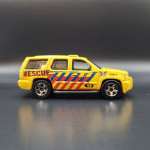 Load image into Gallery viewer, Hot Wheels 2013 '07 Chevy Tahoe Yellow #13 HW City Rescue 3/10
