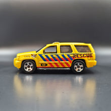 Load image into Gallery viewer, Hot Wheels 2013 '07 Chevy Tahoe Yellow #13 HW City Rescue 3/10