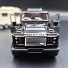 Load image into Gallery viewer, Explorafind 2012 Land Rover Defender with Caravan Black/Cream 1:32 Die Cast