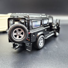 Load image into Gallery viewer, Explorafind 2012 Land Rover Defender with Caravan Black/Cream 1:32 Die Cast