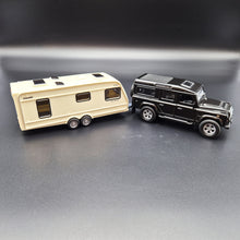 Load image into Gallery viewer, Explorafind 2012 Land Rover Defender with Caravan Black/Cream 1:32 Die Cast