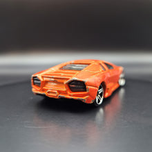 Load image into Gallery viewer, Hot Wheels 2010 Lamborghini Reventón Orange #71 HW Garage 3/10