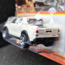 Load image into Gallery viewer, Matchbox 2023 2018 Toyota Hilux White #94 MBX Off-Road New