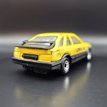 Load image into Gallery viewer, Matchbox 1988 Ford Sierra XR4i Light Yellow #55 Matchbox 1-75