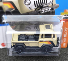Load image into Gallery viewer, Hot Wheels 2024 '57 Jeep FC Tan HW Hot Trucks 3/10 New Long Card