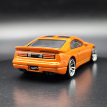 Load image into Gallery viewer, Hot Wheels 2024 Nissan 300ZX Twin Turbo Orange Nightburnerz 5 Pack Exclusive