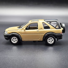 Load image into Gallery viewer, Smart Toys 2003 Land Rover Freelander Gold 1:52 Diecast Car