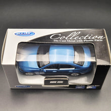 Load image into Gallery viewer, Welly 2005 BMW 330i E90 Metallic Blue #44011 1:43 Collection Series Boxed