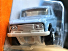 Load image into Gallery viewer, Matchbox 2017 '62 Nissan Junior Light Blue #7 MBX Adventure City New Long Card