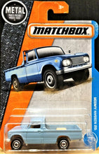 Load image into Gallery viewer, Matchbox 2017 '62 Nissan Junior Light Blue #7 MBX Adventure City New Long Card
