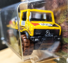 Load image into Gallery viewer, Hot Wheels 2022 Mercedes Benz Unimog 1300 Yellow Mud Runners 1/5 New Long Card
