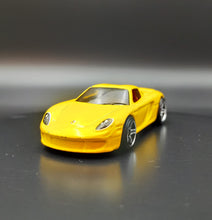 Load image into Gallery viewer, Hot Wheels 2009 Porsche Carrera GT Yellow #9/10 Dream Garage
