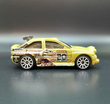 Load image into Gallery viewer, Hot Wheels 2009 Ford Escort Rally Khaki Trick Tracks 5 Pack Loose
