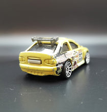 Load image into Gallery viewer, Hot Wheels 2009 Ford Escort Rally Khaki Trick Tracks 5 Pack Loose
