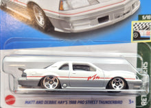 Load image into Gallery viewer, Hot Wheels 2023 Matt &amp; Debbie Hays 1988 Thunderbird White #56 Retro Racers New Long Card
