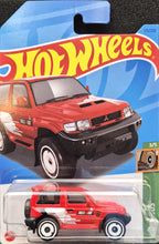 Load image into Gallery viewer, Hot Wheels 2023 Mitsubishi Pajero Evolution Red #175 Mud Studs 3/5 New Long Card
