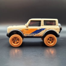 Load image into Gallery viewer, Hot Wheels 2023 &#39;21 Ford Bronco Tan HW Remote Adventures 5 Pack Exclusive

