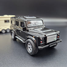 Load image into Gallery viewer, Explorafind 2012 Land Rover Defender with Caravan Black/Cream 1:32 Die Cast
