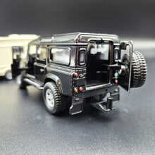 Load image into Gallery viewer, Explorafind 2012 Land Rover Defender with Caravan Black/Cream 1:32 Die Cast
