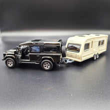 Load image into Gallery viewer, Explorafind 2012 Land Rover Defender with Caravan Black/Cream 1:32 Die Cast
