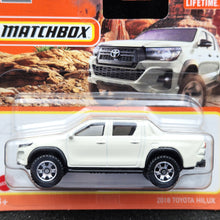 Load image into Gallery viewer, Matchbox 2023 2018 Toyota Hilux White #94 MBX Off-Road New
