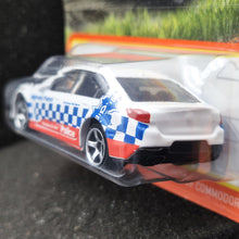 Load image into Gallery viewer, Matchbox 2023 Holden VF Commodore SSV White #35 MBX Roadtrip New Long Card
