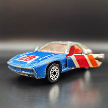 Load image into Gallery viewer, Matchbox 1986 Porsche 928 Blue/White #SF3 Matchbox 1-75
