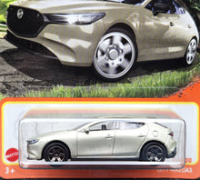 Load image into Gallery viewer, Matchbox 2024 2019 Mazda 3 Champagne #77 MBX Roadtrip New Long Card
