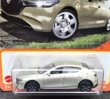 Load image into Gallery viewer, Matchbox 2024 2019 Mazda 3 Champagne #77 MBX Roadtrip New Long Card
