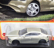 Load image into Gallery viewer, Matchbox 2024 2019 Mazda 3 Champagne #77 MBX Roadtrip New Long Card
